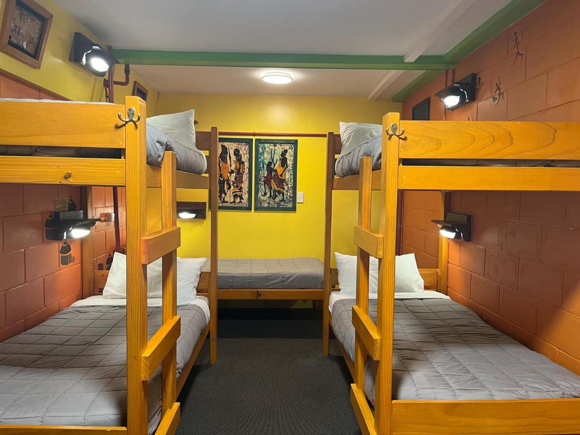 Global Village Travellers Lodge Greymouth Exterior photo A bunk room at a hostel in New Zealand