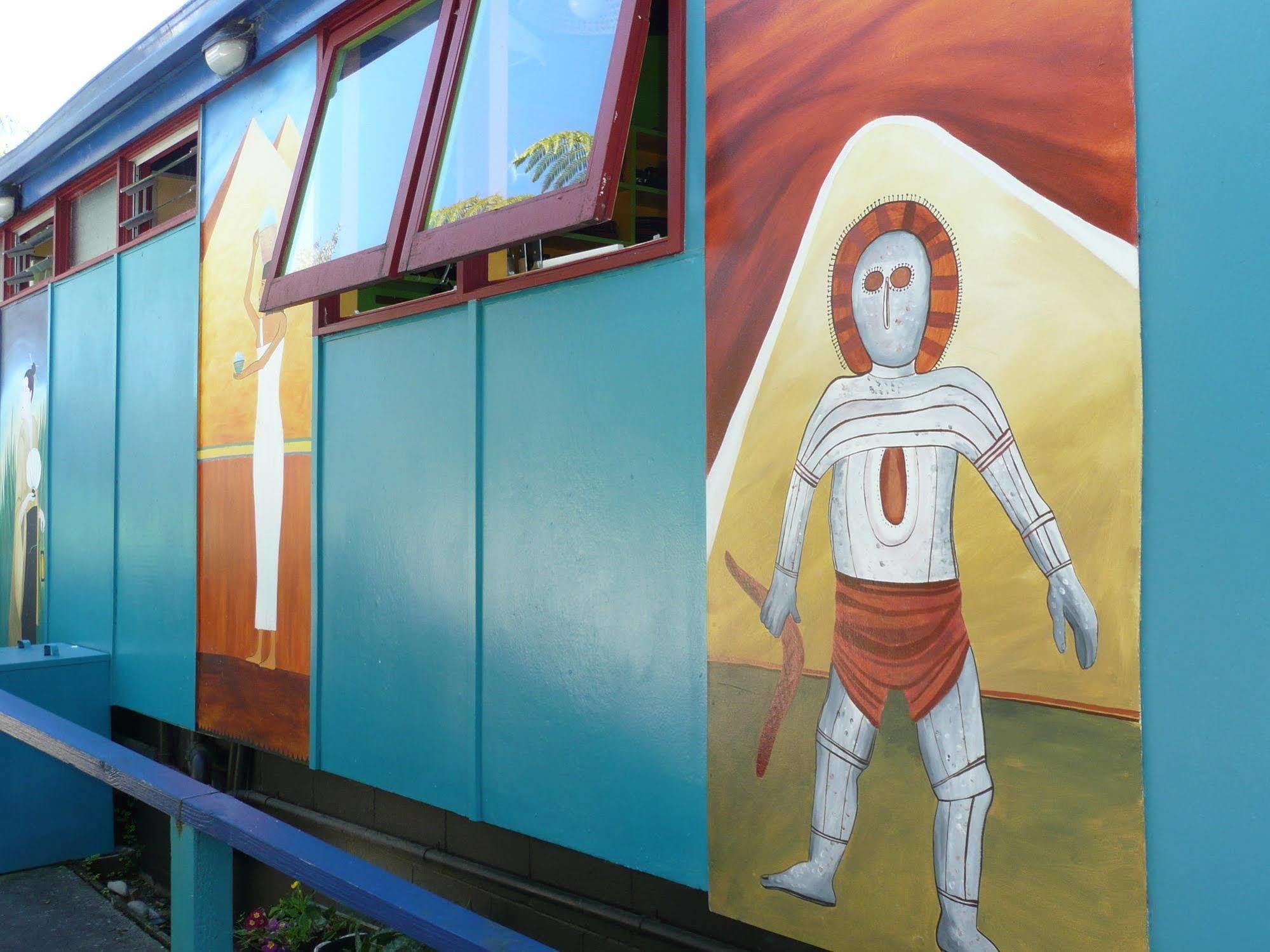 Global Village Travellers Lodge Greymouth Exterior photo The Tin Man, a character from The Wizard of Oz, is depicted on the side of the Tin Man Motel in Clinesville, Texas.